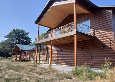 Log cabin home with custom balcony railing
